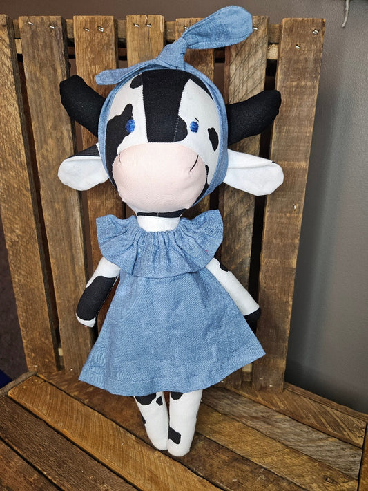 Black and White Cow with Blue Dress