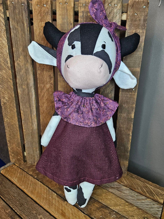 Black & White Cow with dark plum dress