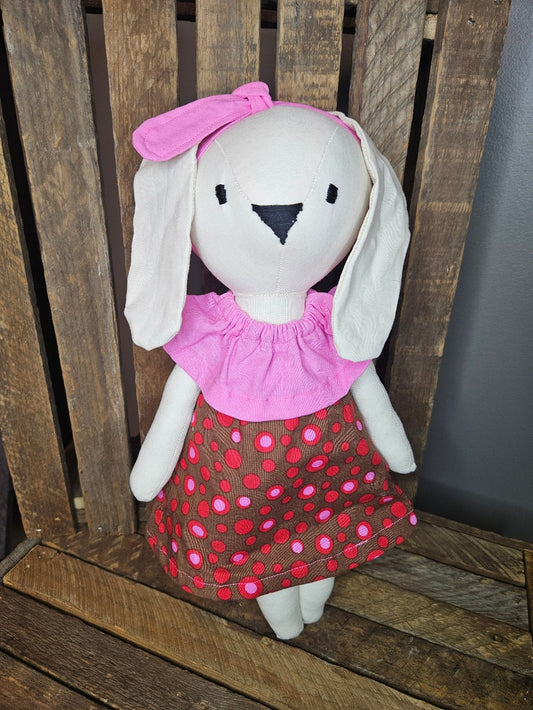 Cream bunny with bright pink, brown and red print dress