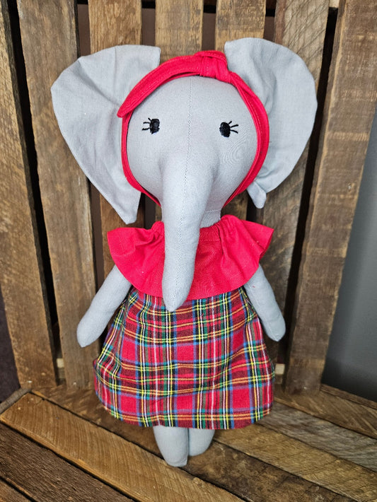 Light gray elephant with red plaid dress