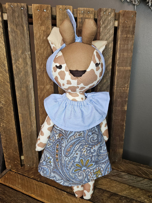 Giraffe with periwinkle blue paisley dress