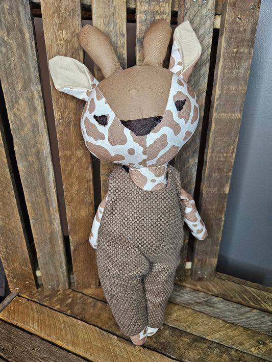 Giraffe with brown plaid overalls