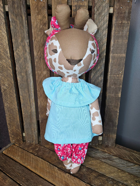 Giraffe with teal top and coral floral  pants